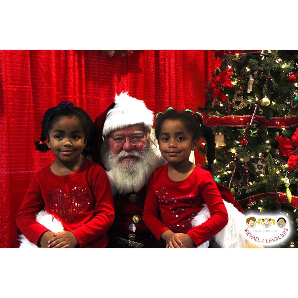 African_American_twins_visiting_Santa
