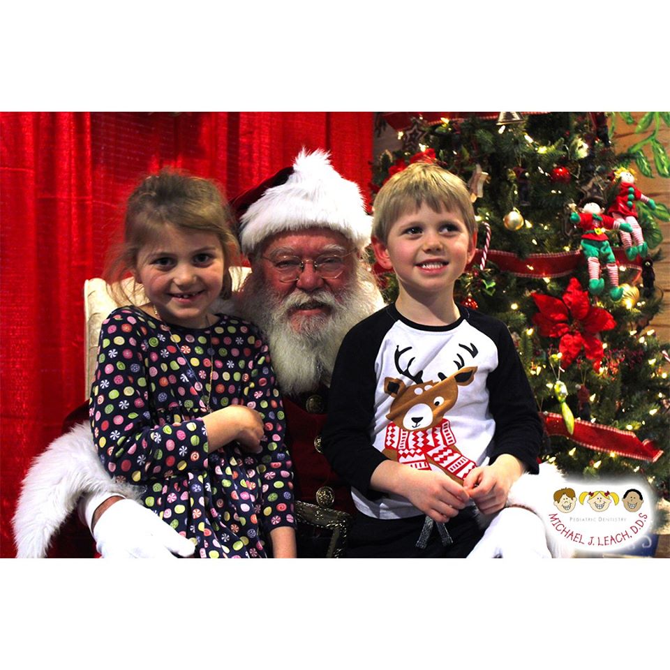 brother_and_sister_seeing_Santa_Pediatric_Dentist_Alpharetta
